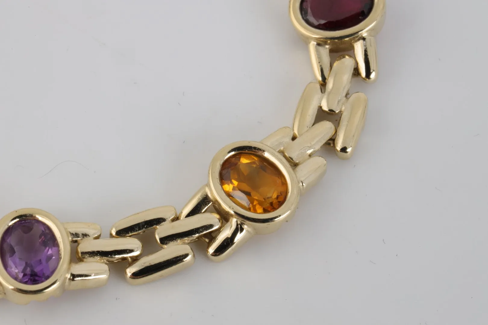 7” 14k Yellow Gold Amethyst, Blue Topaz, Citrine & Garnet Bracelet (19.10g.)