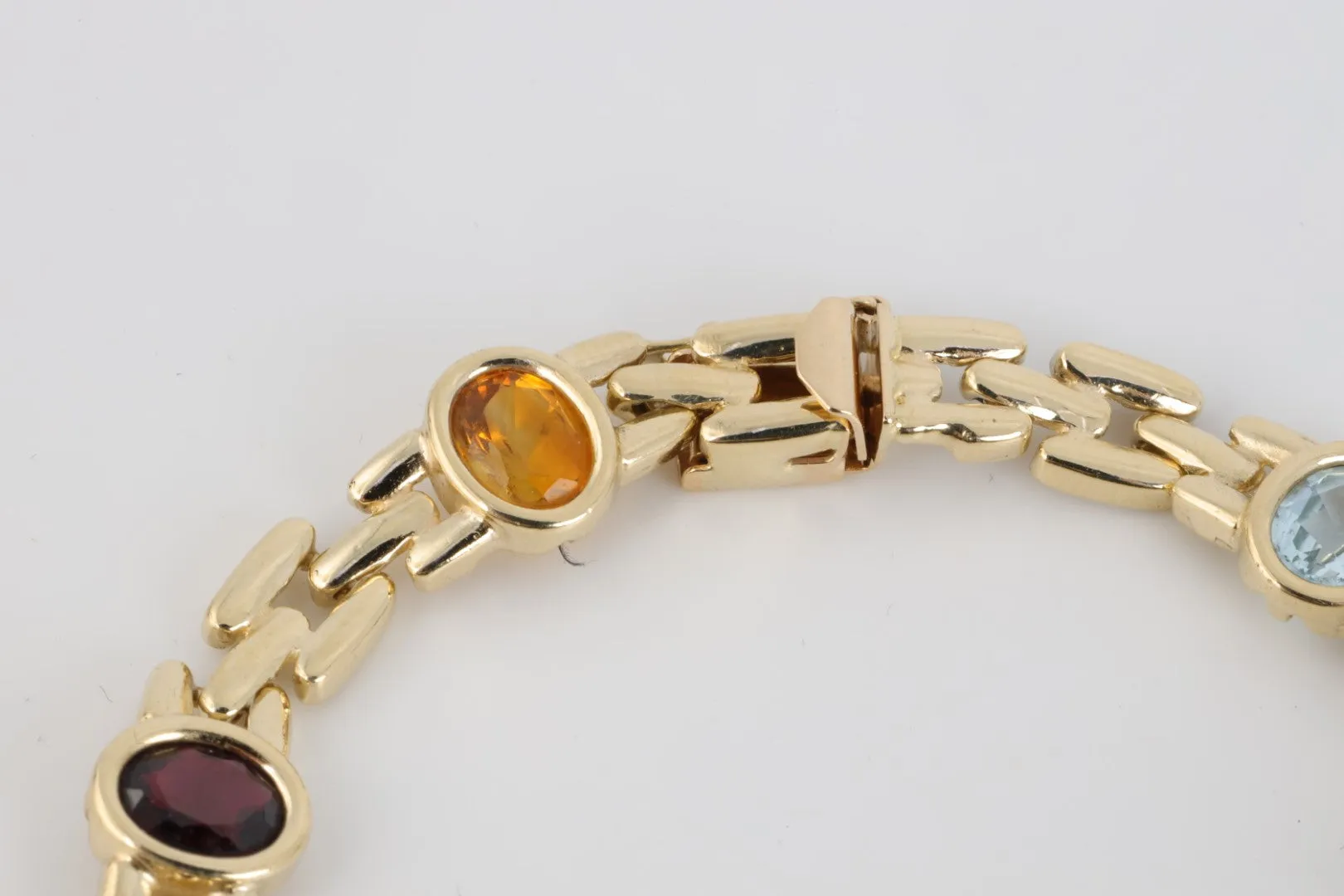 7” 14k Yellow Gold Amethyst, Blue Topaz, Citrine & Garnet Bracelet (19.10g.)