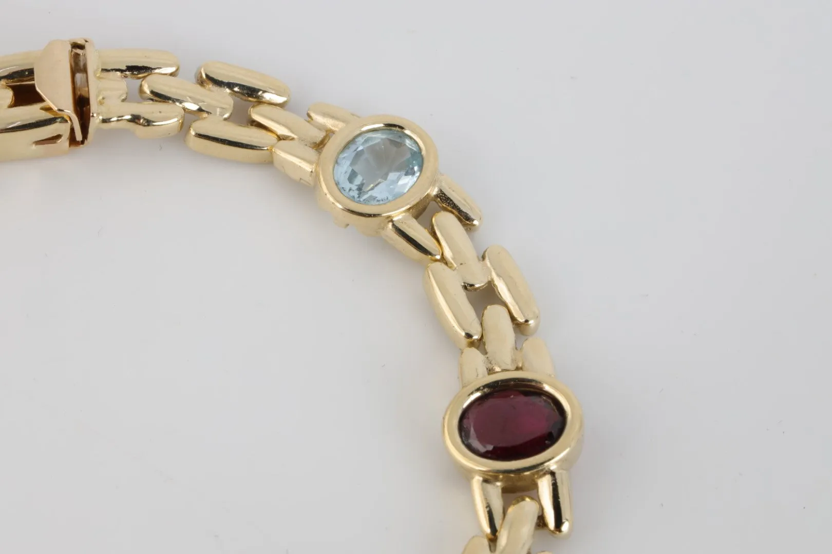 7” 14k Yellow Gold Amethyst, Blue Topaz, Citrine & Garnet Bracelet (19.10g.)