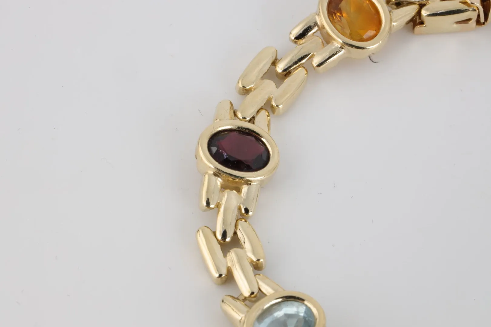 7” 14k Yellow Gold Amethyst, Blue Topaz, Citrine & Garnet Bracelet (19.10g.)