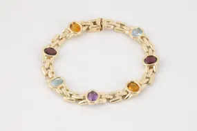 7” 14k Yellow Gold Amethyst, Blue Topaz, Citrine & Garnet Bracelet (19.10g.)