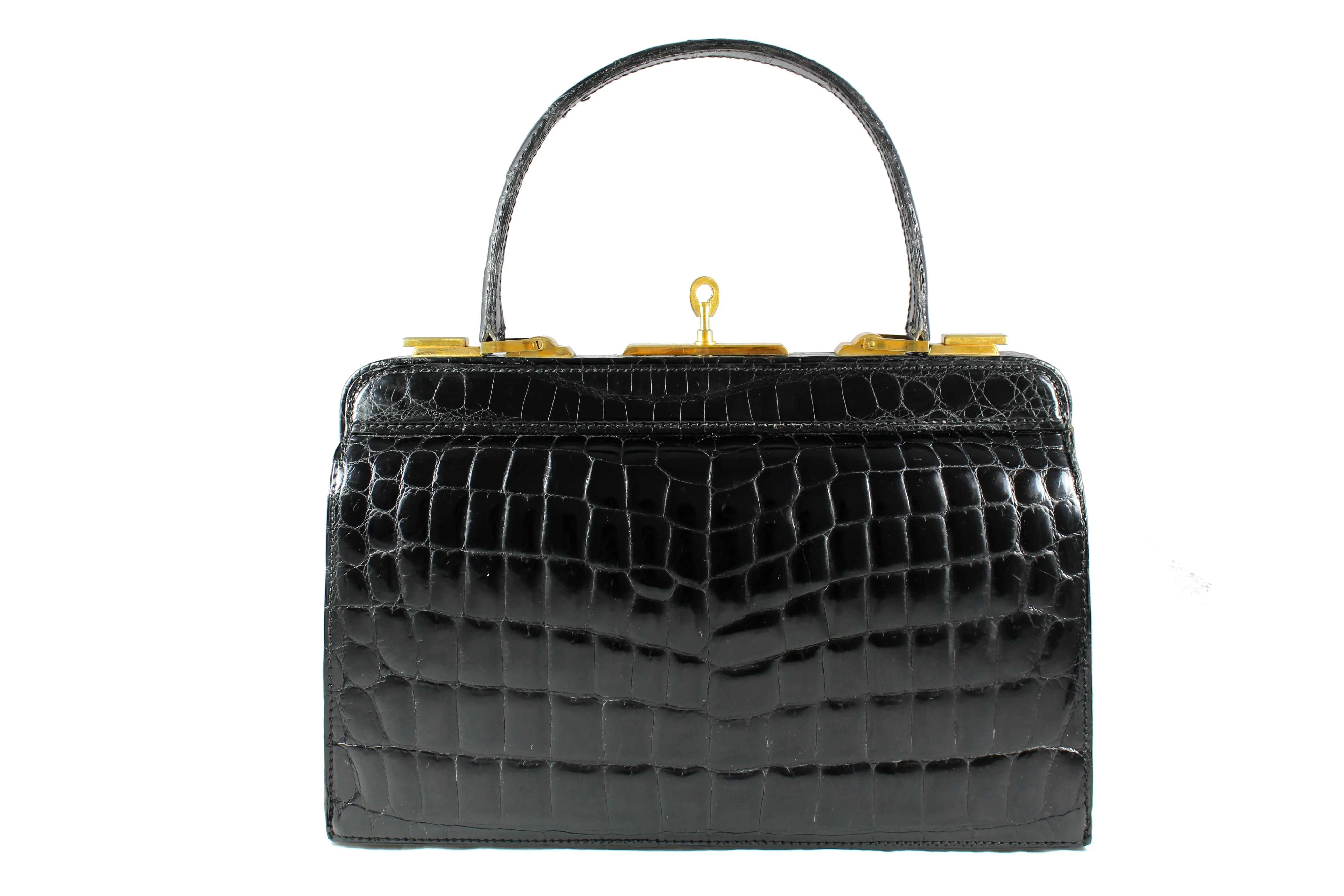 Black crocodile skin handbag with lined frame and key lock